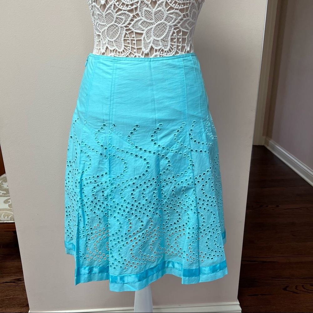 Turquoise blue pleated skirt with eyelet like cut outs